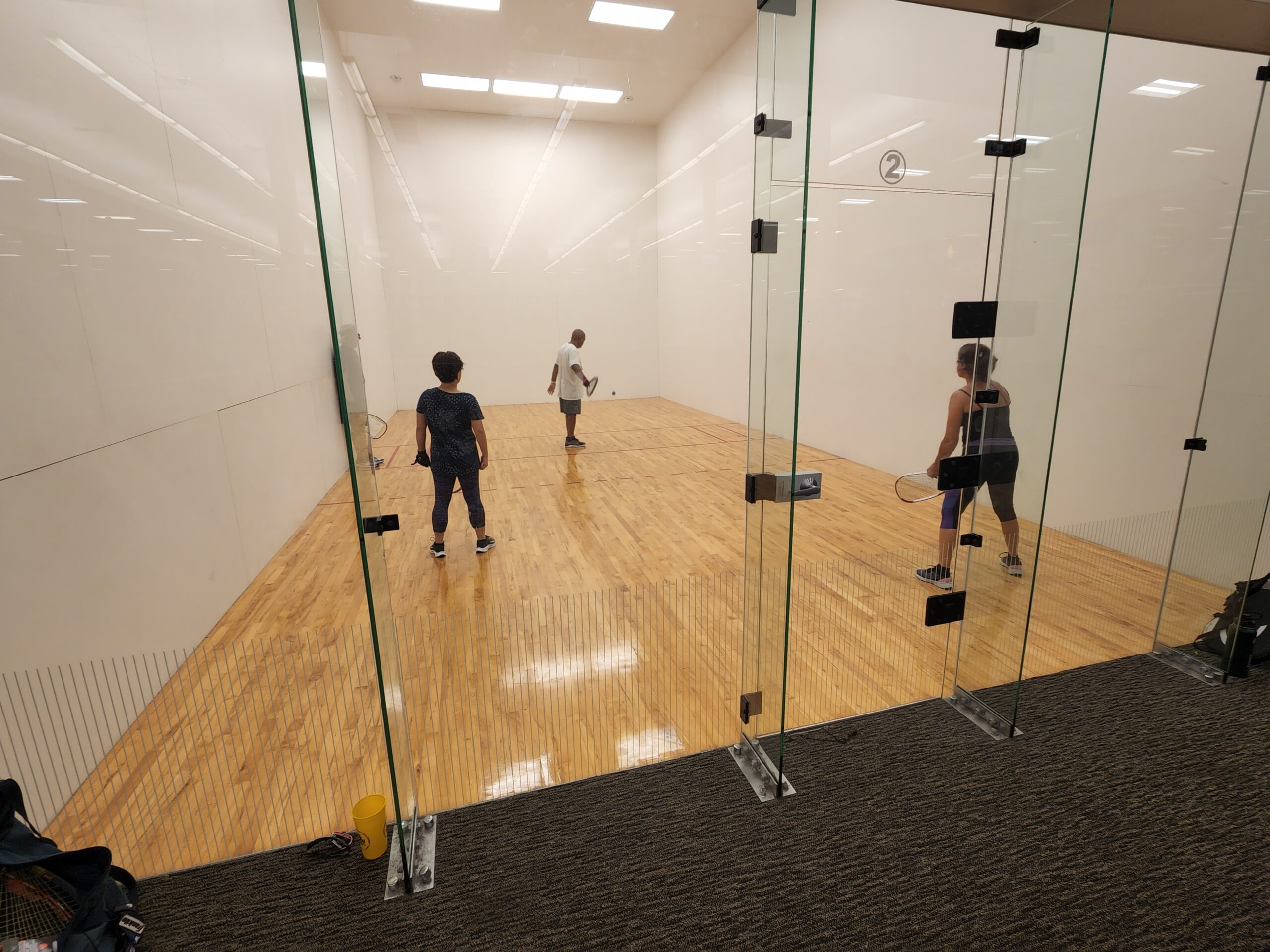 People playing racquetball